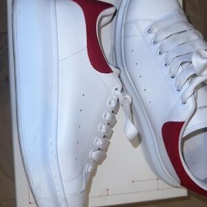 Alexander McQueen women's red and white sneakers